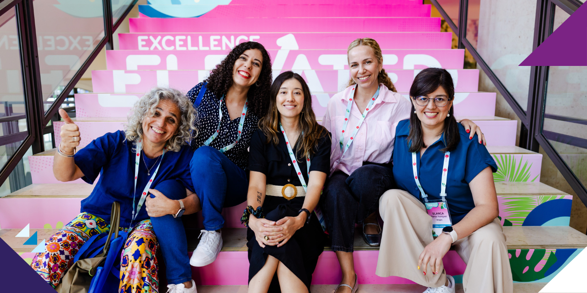 LTEN members gathered at the conference taking a picture on the branded stairs